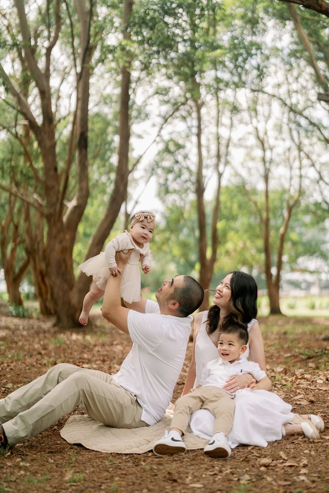 A young family playing together in the park — photographed by Katrina from Films and Stills